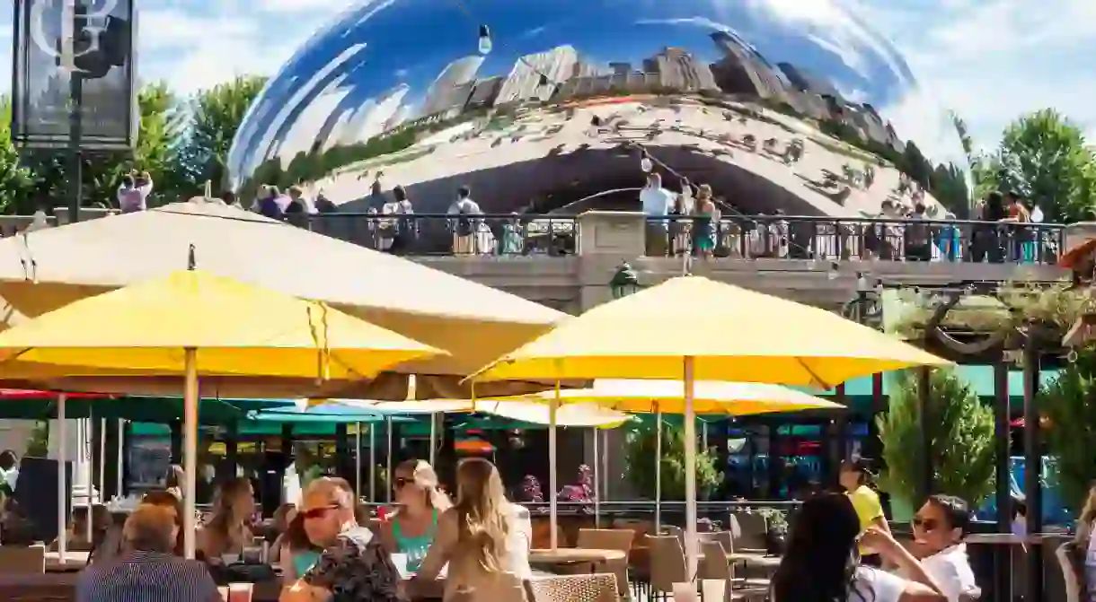 The sculpture looms over Millenium Park – a popular spot for al fresco dining