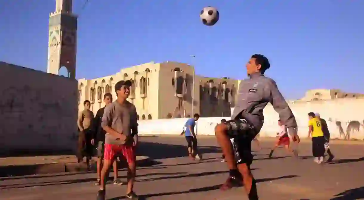 Youths play football in Casablanca