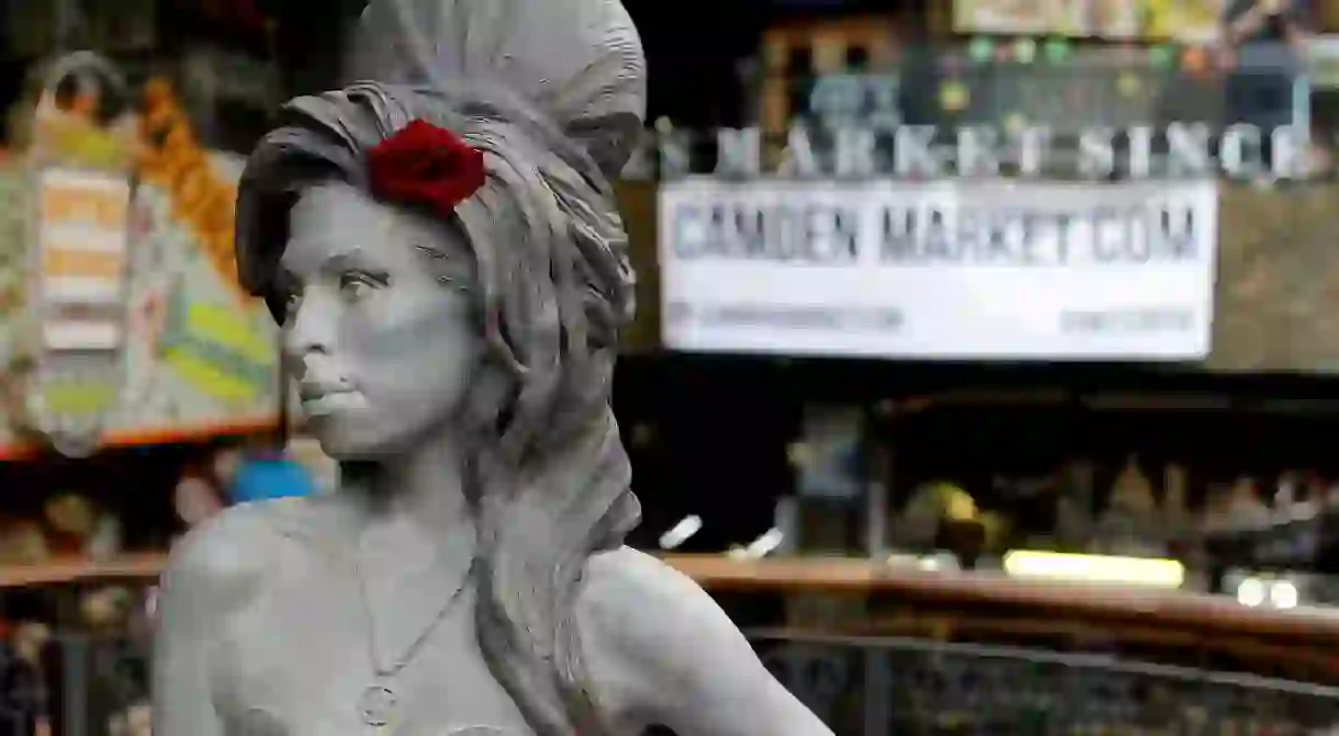 A life-size bronze statue of Camden local Amy Winehouse, complete with a red rose in her trademark beehive hairdo