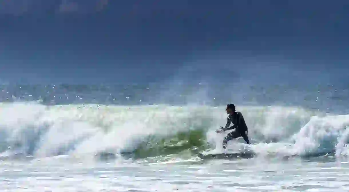 Surfing at The wreck off Belongil beach, Byron bay, New South Wales, Australia.