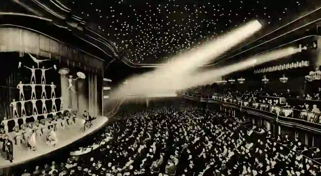 An audience watches acrobats perform at the Wintergarten in Berlin in the early 1900s