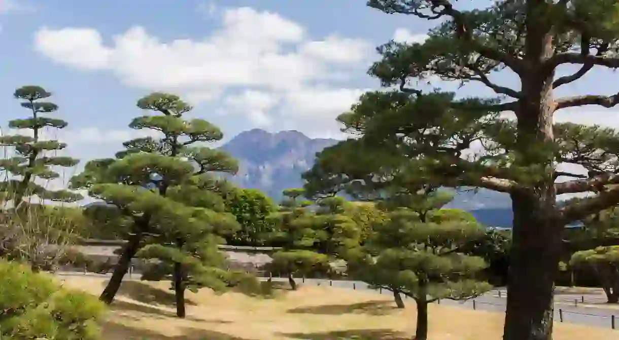 The peaceful Sengan-en garden is set against the backdrop of Sakurajima volcano