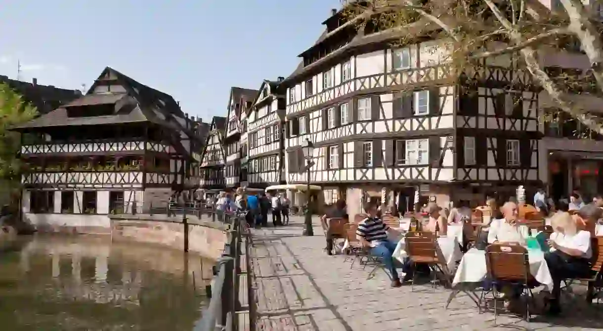 Cafe, restaurant on Place Benjamin Zix square, half-timbered houses, LIll river, Petite France, Strasbourg, Alsace, France