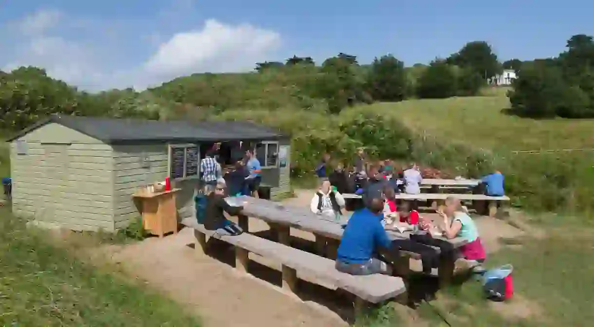 Hidden Hut at Porthcurnick Beach in Cornwall offers a truly authentic seaside experience