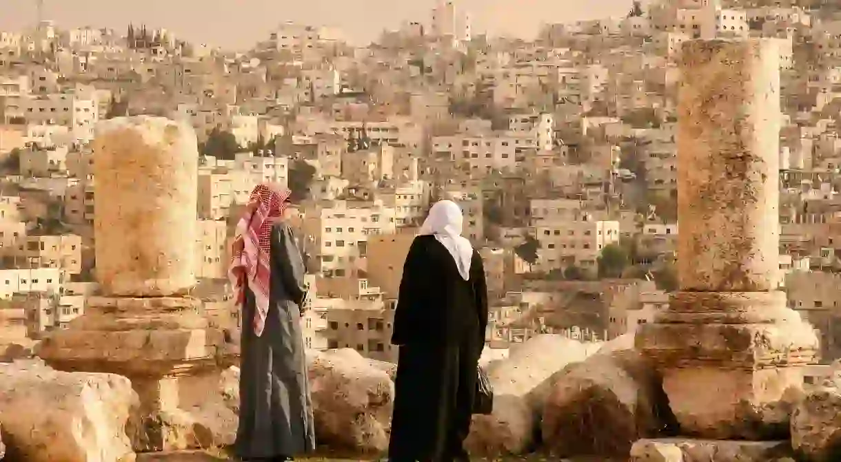 Take in the view of Jordans capital Amman from the Hill of the Citadel, or Jabal al-Qala