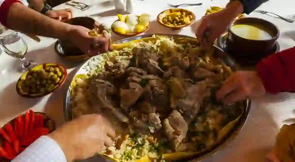 Mansaf ( lamb cooked in a sauce of fermented dried yogurt and served with rice). The national dish of Jordan.