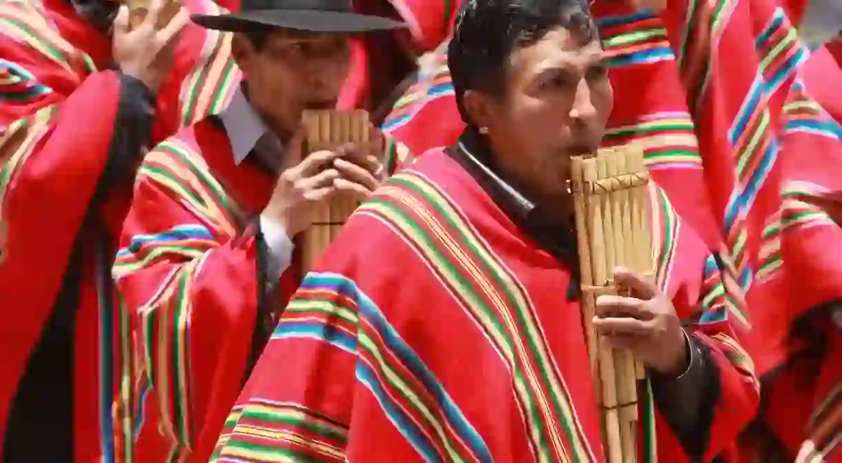 A man plays the panpipe in La Paz