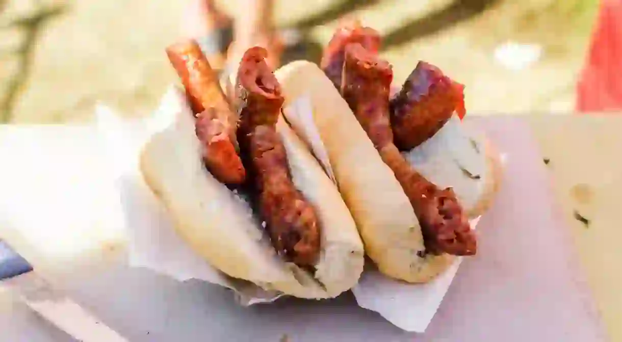 Traditional Argentine choripan sandwich with pork sausages