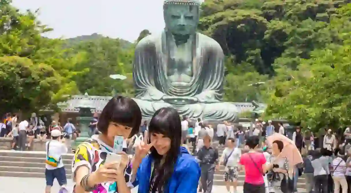 Whereabouts in the world is it illegal to take selfies in front of idols of Lord Buddha?