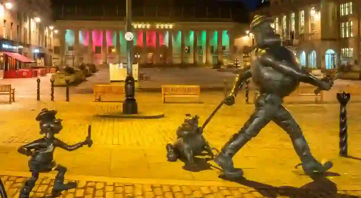 Statues of Minnie the Minx with Desperate Dan and Dawg grace the high street in Dundee