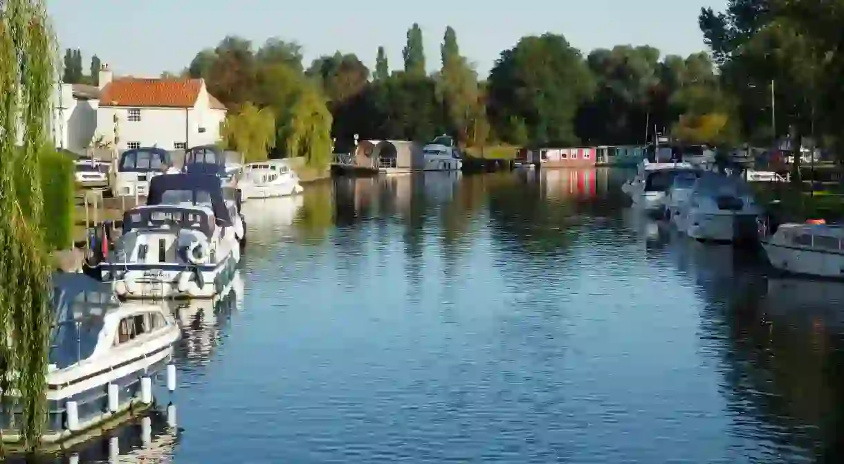 Keep your carbon footprint minimal by renting a houseboat on the Norfolk Broads