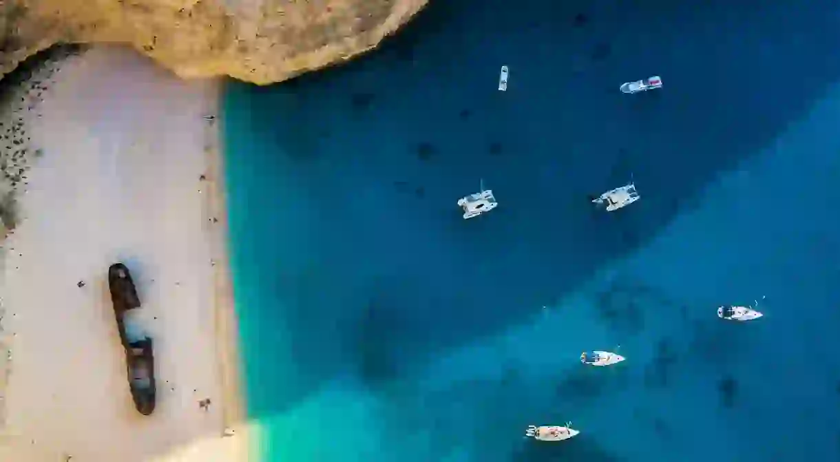 The idyllic blue waters and white sands of Navagio Beach