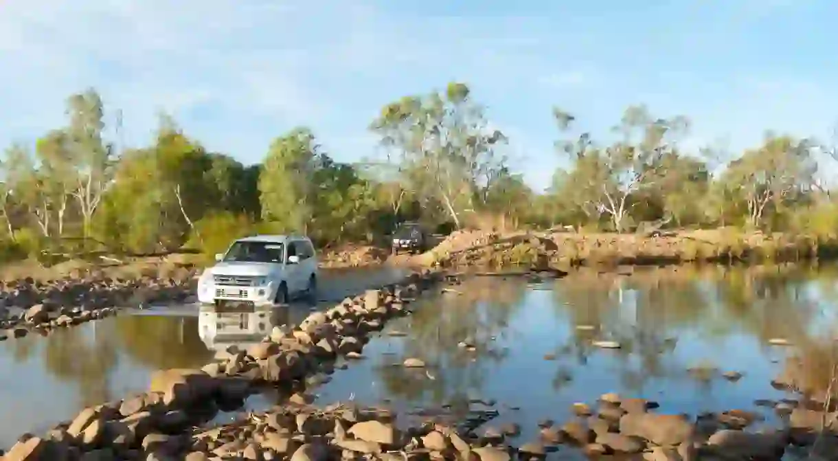 Car crossing a river along the Gibb River Road, Kimberley, Outback, Western Australia, WA, Australia