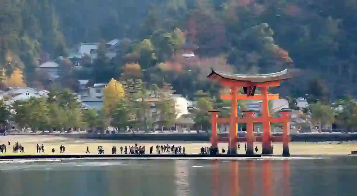 Miyajima is known for its striking red torii gate, which appears to float in the sea