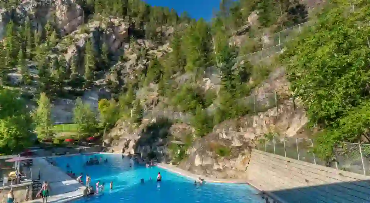 Soaking in an outdoor pool at the Radium hot springs makes a great excursion from Banff