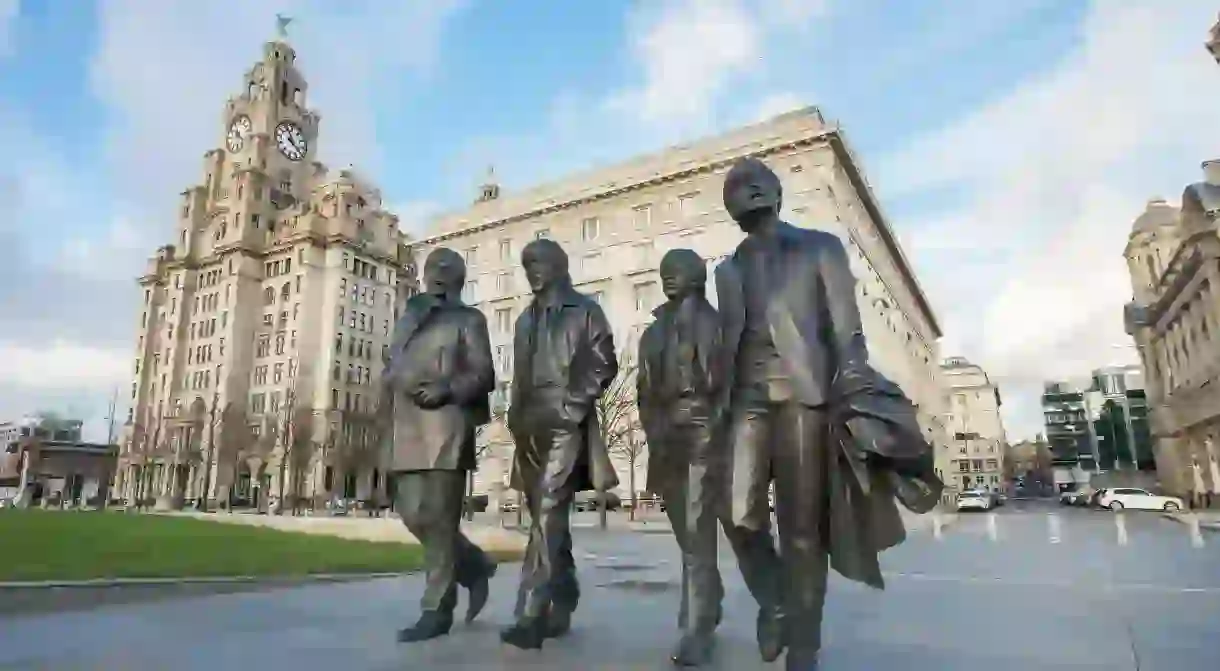 Statue of the Beatles stands in the heart of Liverpools cultural epicentre near the docks