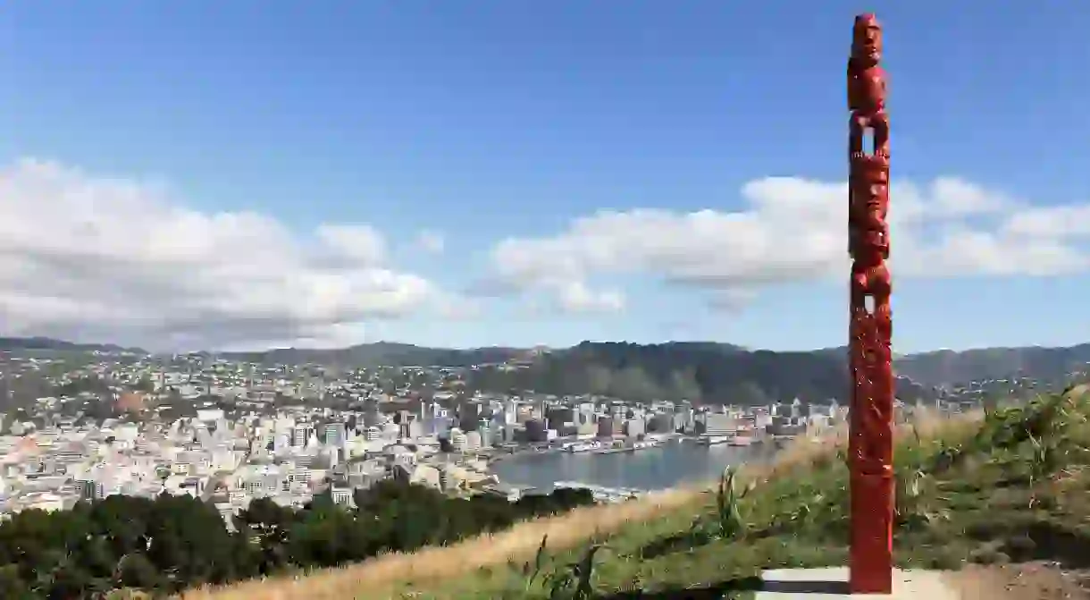 A Māori sculpture sits atop Mount Victoria in Wellington