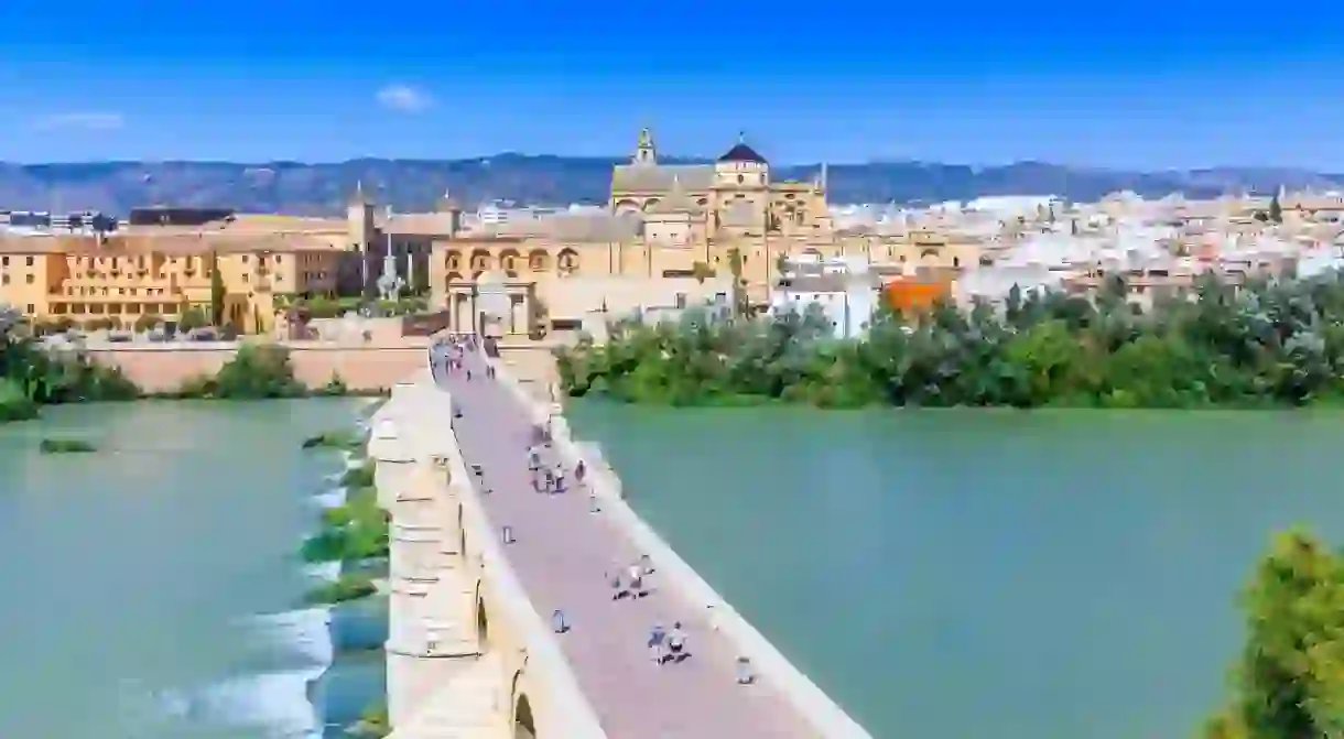 The Roman Bridge in Córdoba spans the River Guadalquivir and dates back to the first century