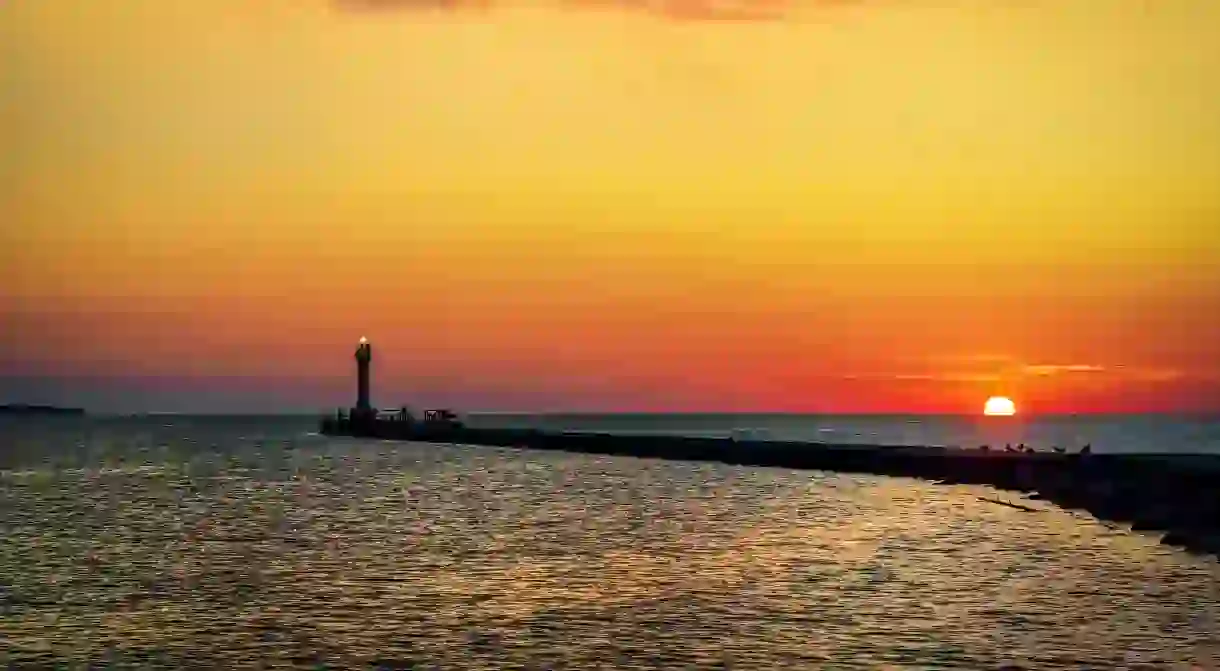 Lake Michigan sparkles during the day and at night