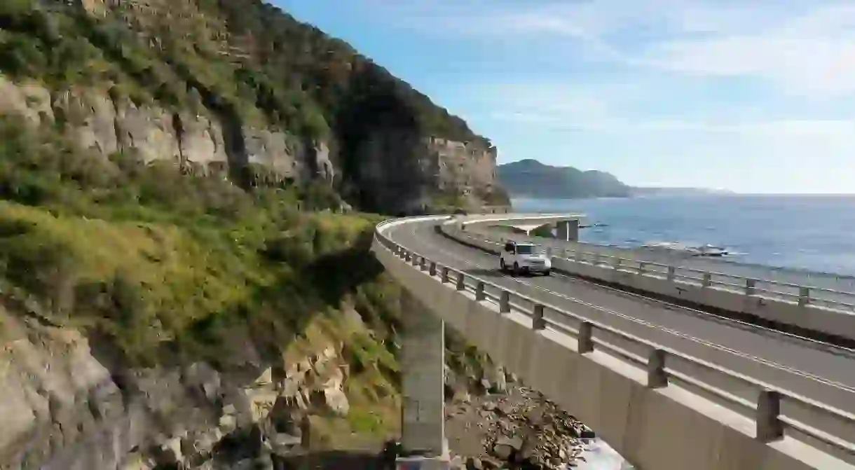 Travelling on the sea cliff bridge coastal drivel along the Grand pacific drive, East coast of Australia