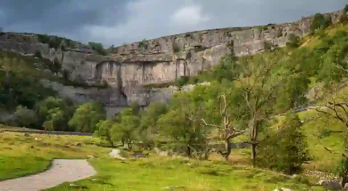 Malham Cove is a limestone formation in Yorkshire Dales National Park, England.