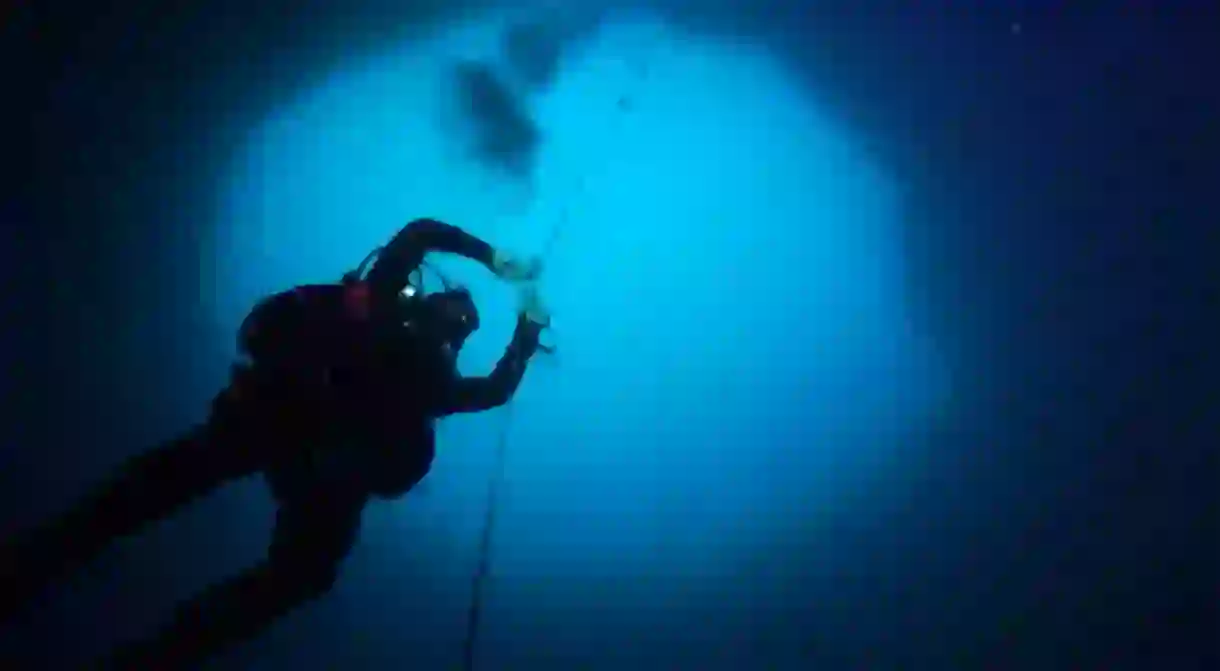 Scientists collect various samples from blue holes to learn more