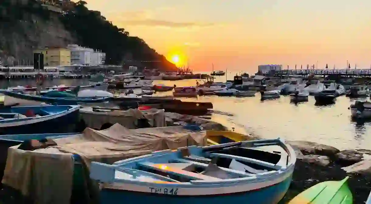 Enjoy the sunset from the Marina Grande in Sorrento, Italy