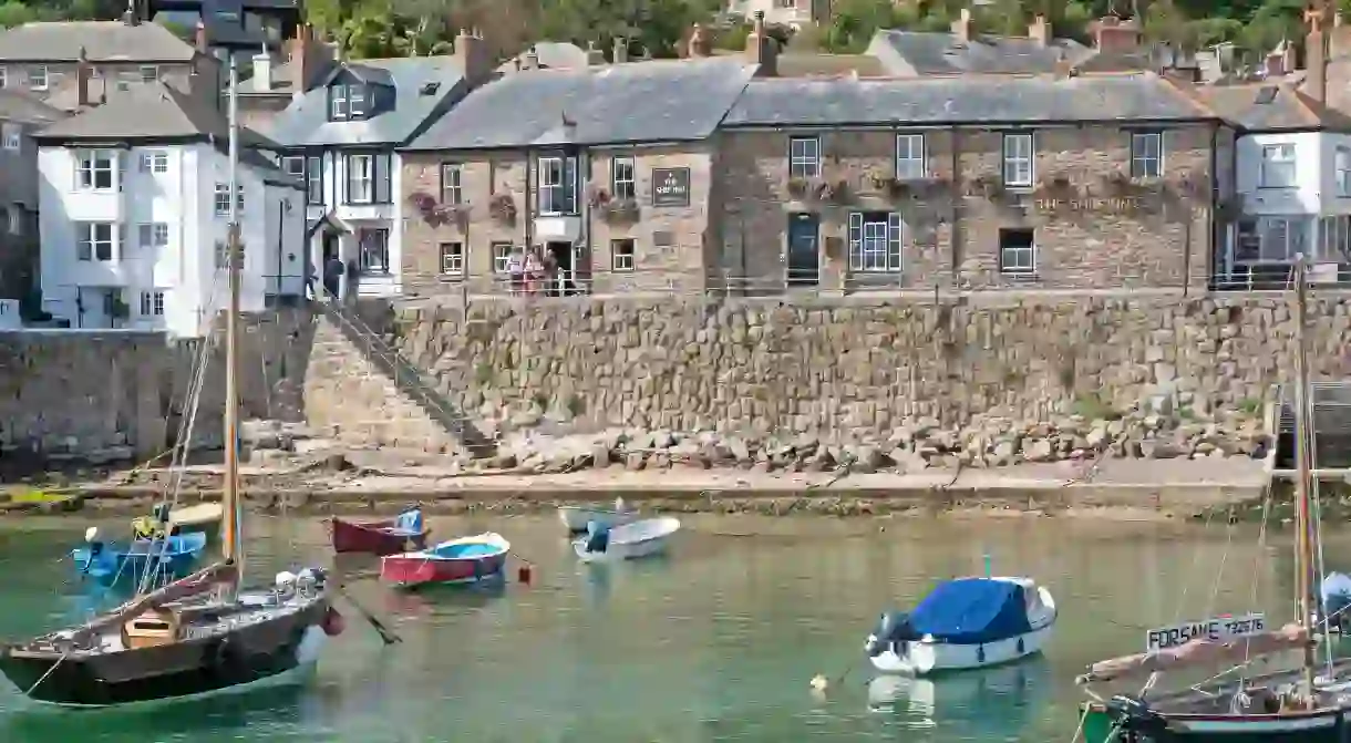 Enjoy views of peaceful bobbing boats in the harbour from your room at The Ship Inn, in Mousehole near Penzance