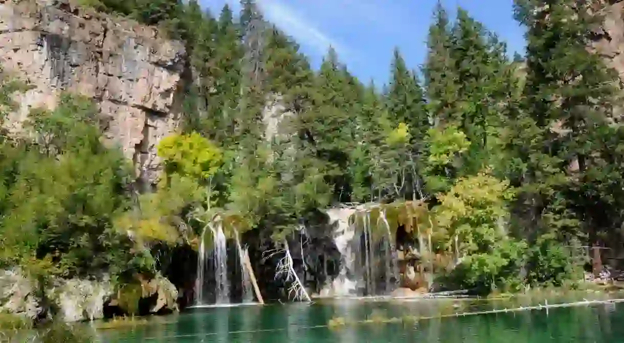 Must-visit Colorado waterfalls include Hanging Lake near Glenwood Springs