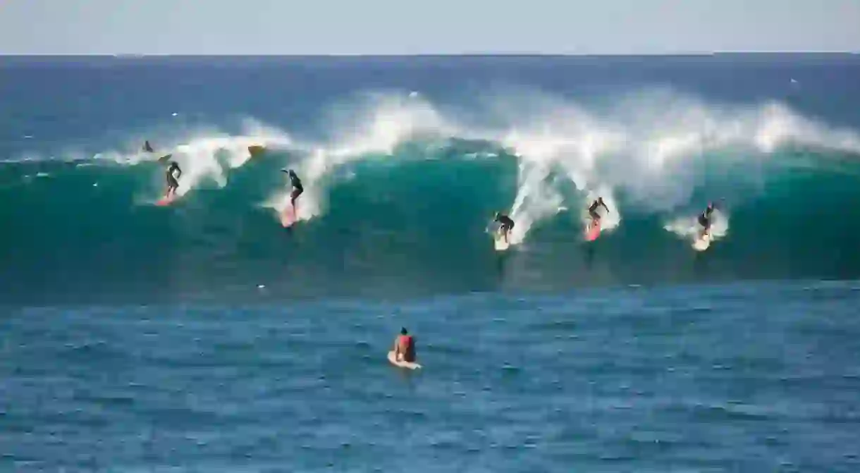 Catching a wave at Waimea Bay, on Oahu