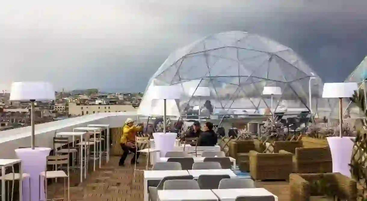 The Ice Cube bar, above Galeries Lafayette, in Paris, is just one of the citys many rooftop bars with amazing views