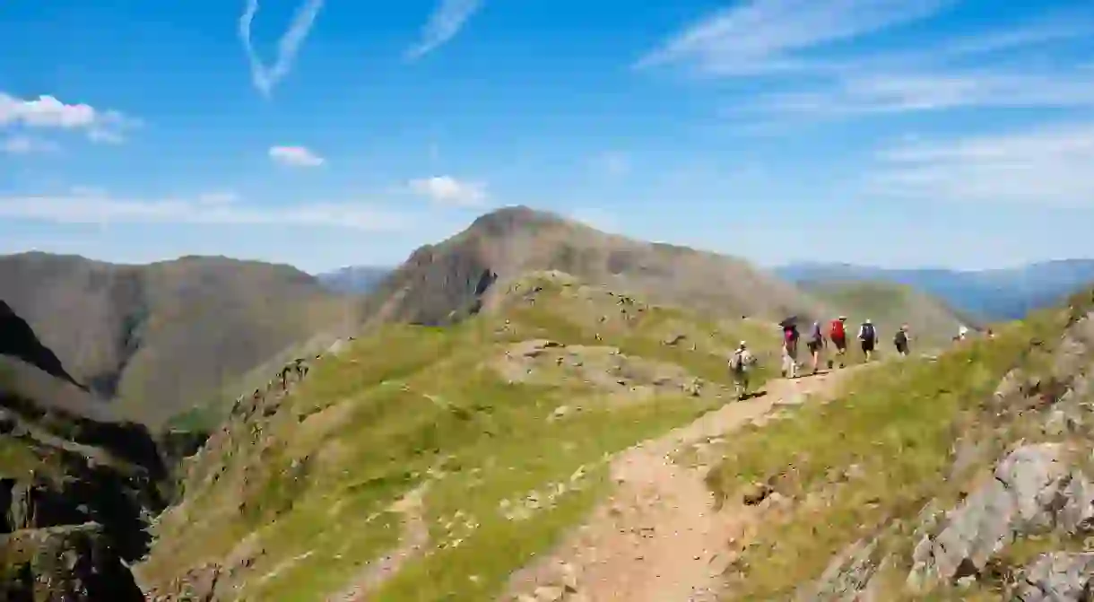 Hike the Corridor Route mountain path over Sty Head and stop for a picnic at the top