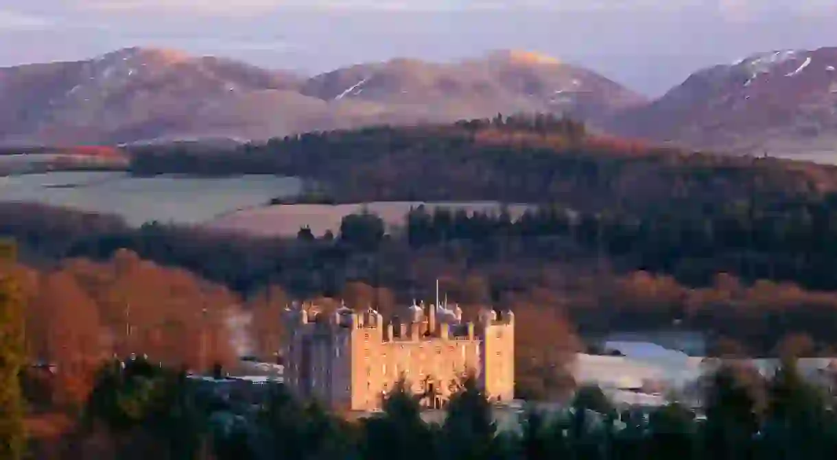 Sunrise winter snow on the Lowther Hills behind Drumlanrig Castle in scenic landscape of the Nith Valley, Nithsdale, Scotland UK