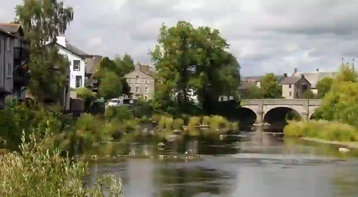 Kendal, in Cumbria, with the River Mint running through it, is a pretty spot to stay in during your Lake District holiday