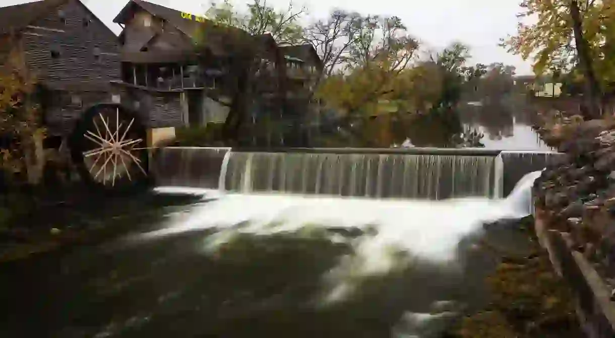 Enjoy a rustic stay and catch a glimpse of Little Pigeon River running over the weir through Pigeon Forge, Tennessee