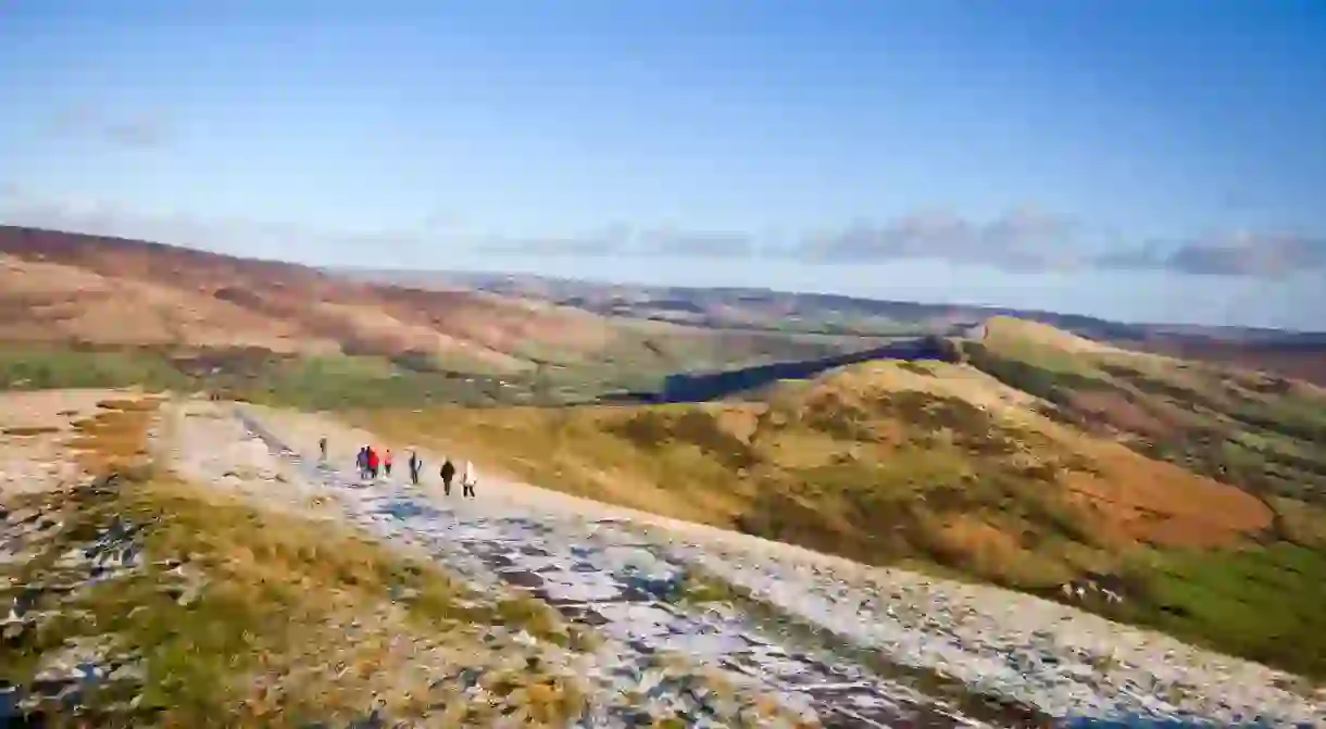 Hikers making the descent from the top of Mam Tor