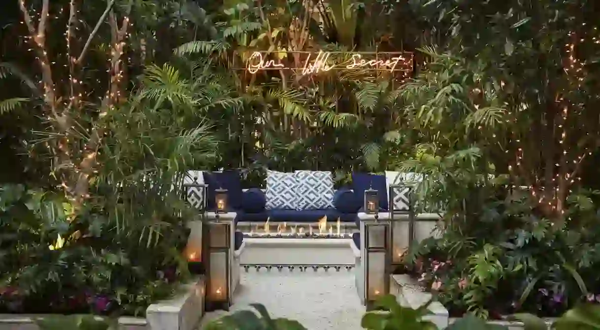 The jungle-like courtyard is the centerpiece of this Four Seasons hotel