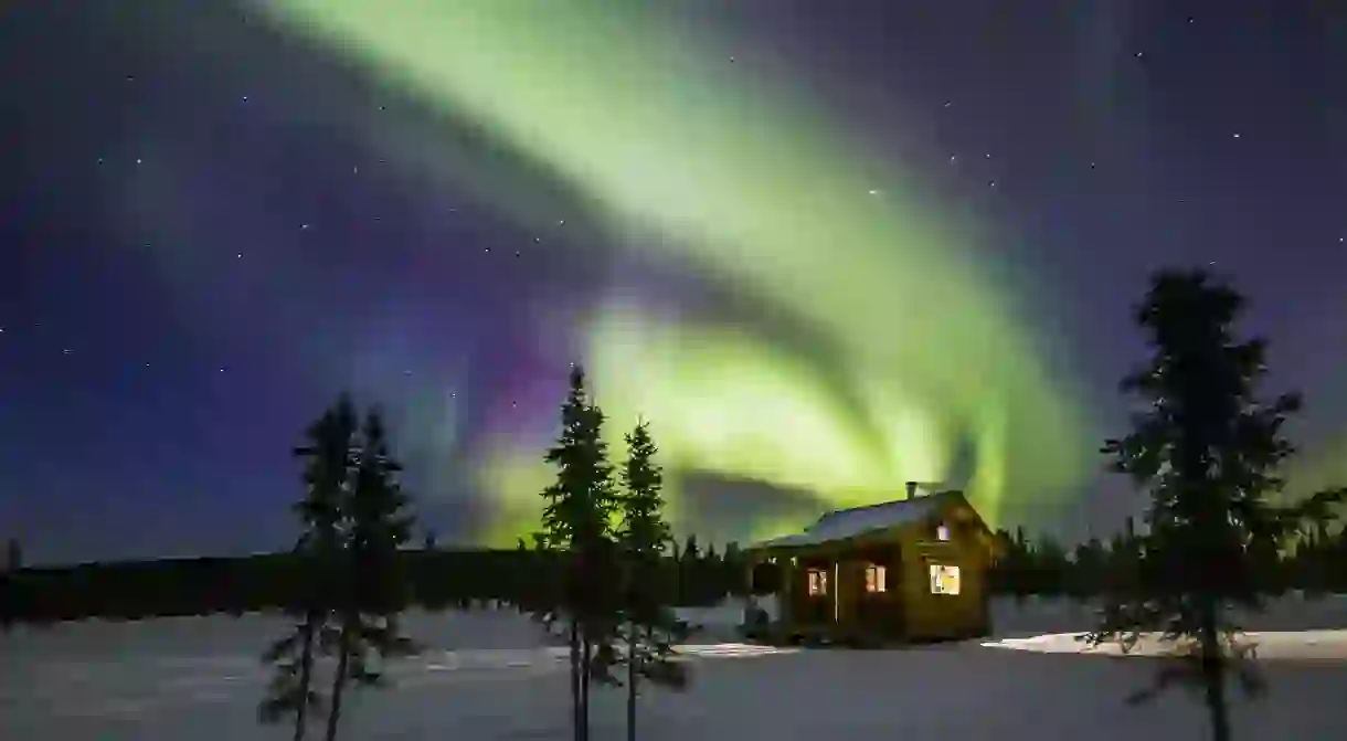 Northern Lights over a cabin