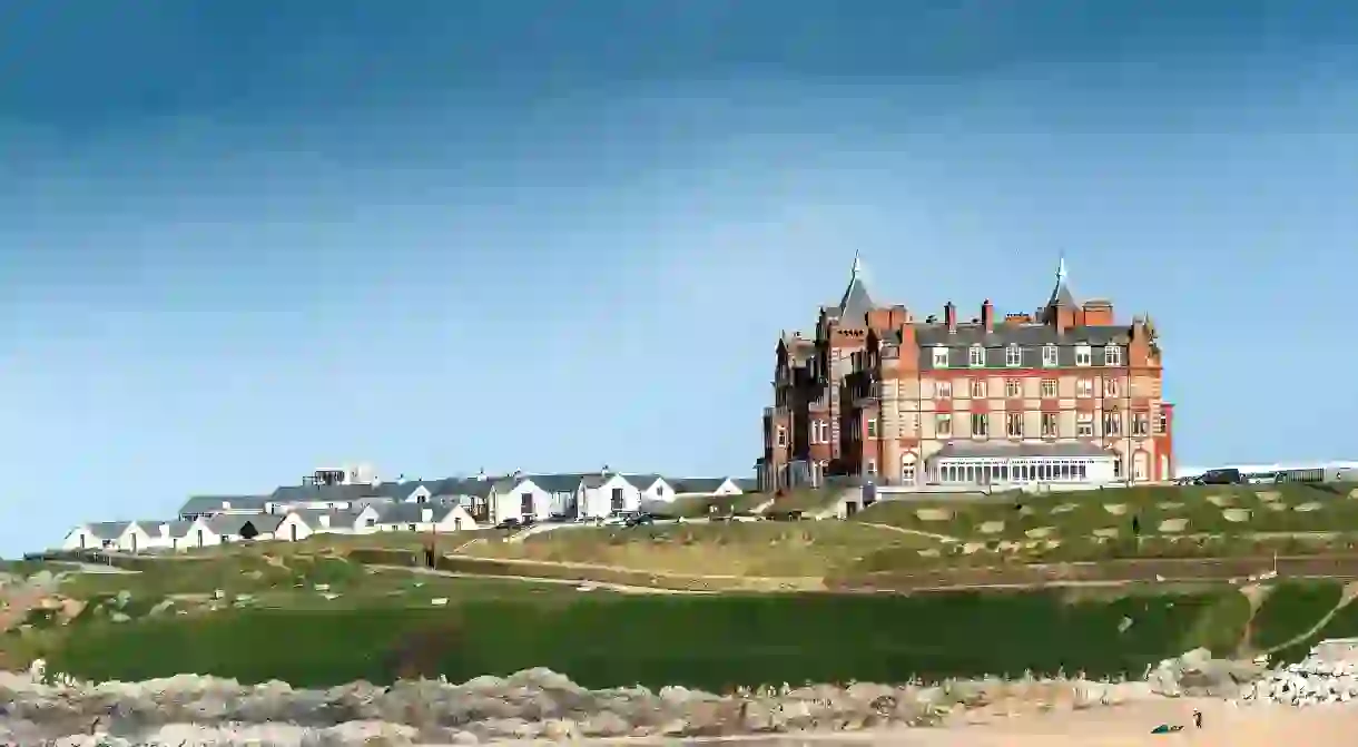 The iconic Headland Hotel overlooking Fistral Beach in Newquay in Cornwall.