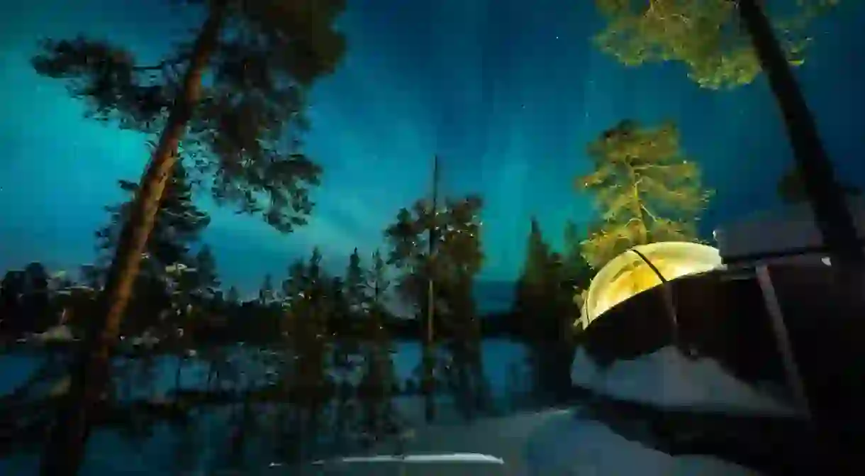 Watch the Northern Lights through your hotel rooms glass ceiling