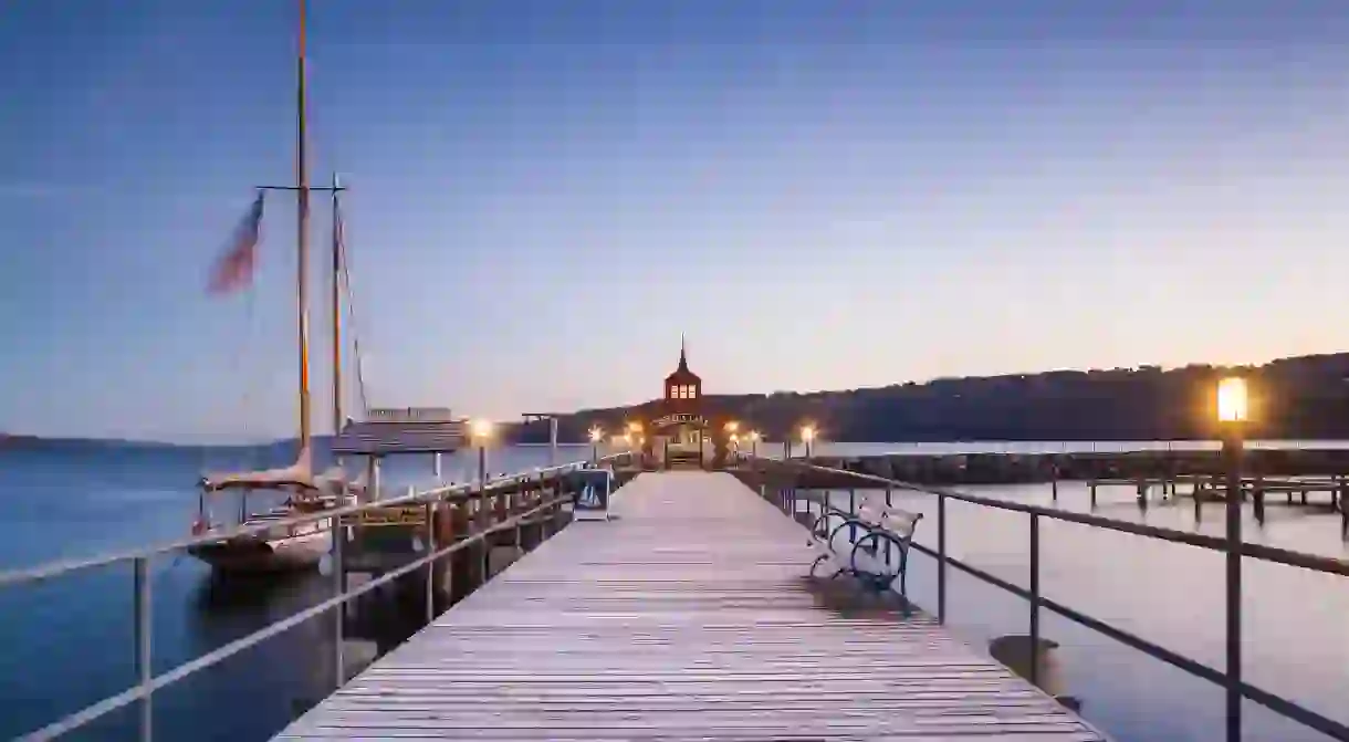 Seneca Lake pier in Watkins Glen glistening during dusk