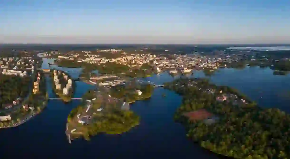 Bridges connect Oulu, Finland, to small tree-covered islands in the bay