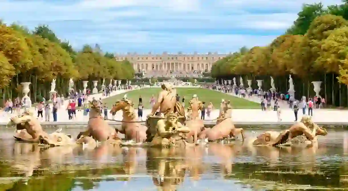 The famous Apollo Fountain and the gardens of the Palace of Versailles near Paris