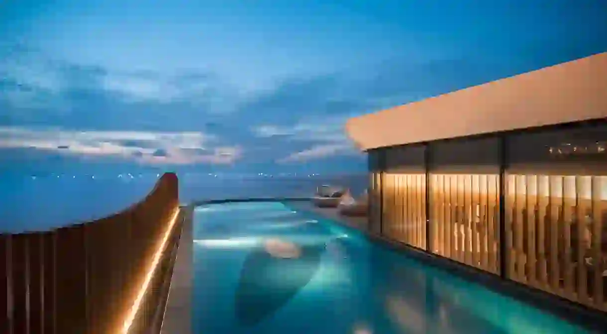 Survey the city in style from an infinity pool overlooking Manila Bay