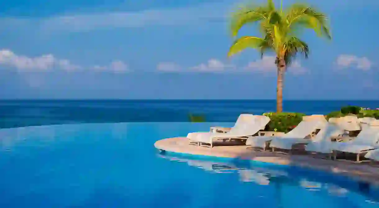 Relax by the pool at the Four Seasons in Punta Mita, Mexico