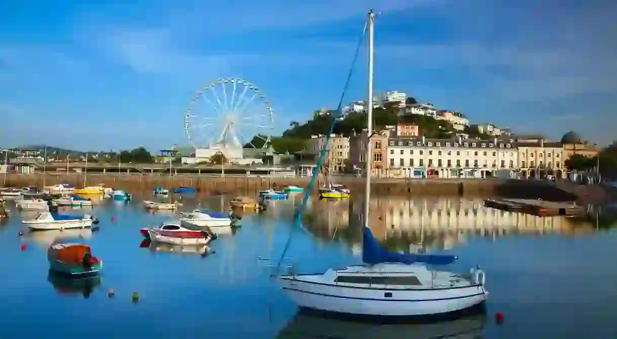 The English seaside town of Torquay is brimming with charming cafés, pretty shops and Michelin-star restaurants, alongside cliff-baked beaches and secluded bays