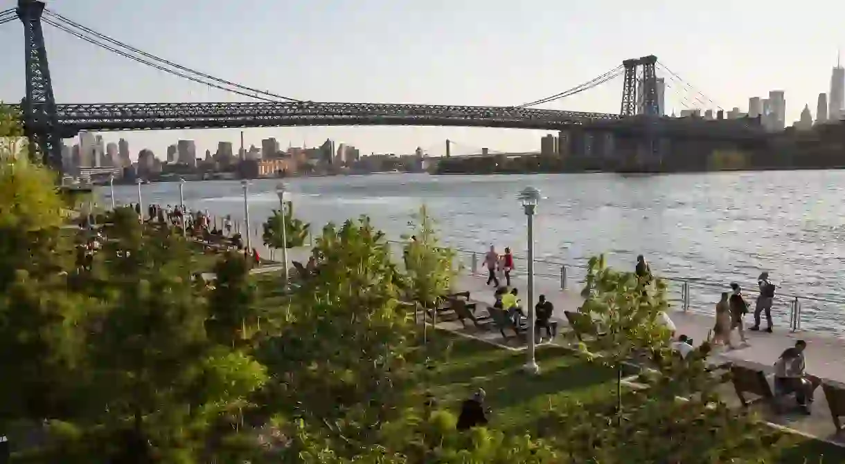 Domino Park is a great spot to stroll and take in the views of Brooklyn Bridge and Manhattan across the East River