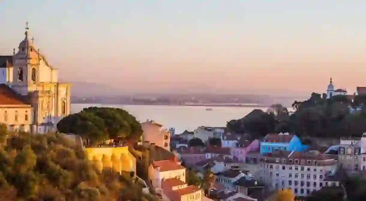 After a long day of sightseeing, relax in your own apartment and enjoy a view of Lisbon like this one – the Igreja de Convento da Graca at sunset