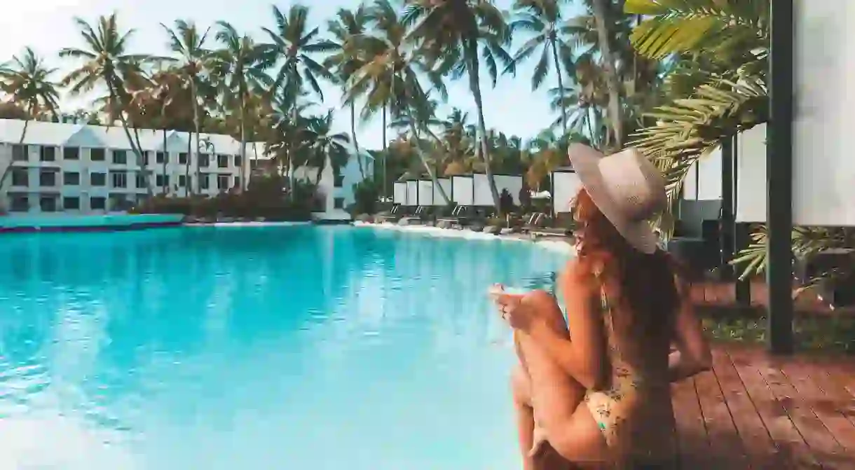 Relax poolside at the Sheraton Grand Mirage Resort, Port Douglas