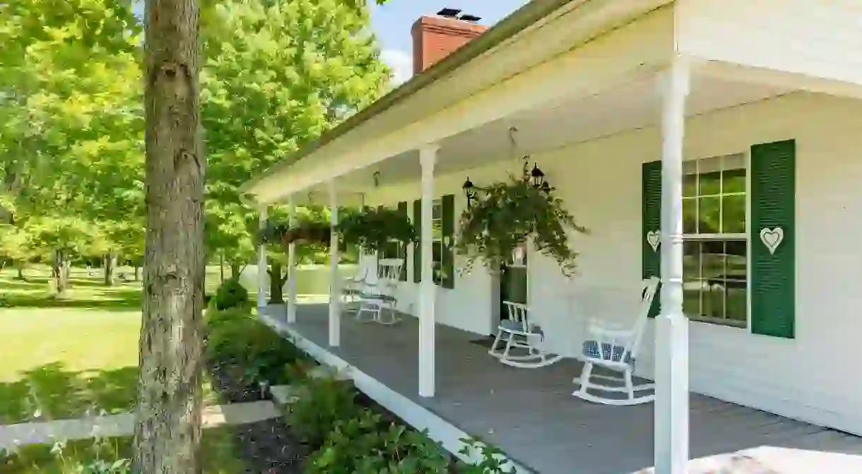 Relax on the wraparound porch of the Bear Creek Farm B&B in Kingsville, Ohio